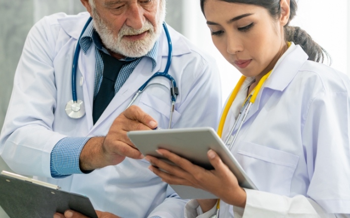 doctor checking results on a tablet