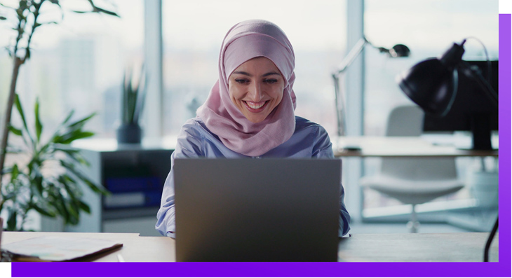 woman with a hijab using a computer