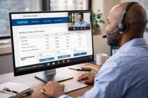 Employee watching a video demo of an online insurance platform on a desktop computer