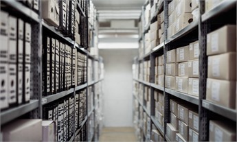 400-Token Precision Chunking: organized archive shelves with structured document storage representing precise data segmentation and context preservation in enterprise knowledge systems