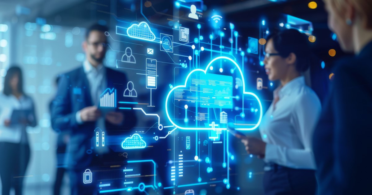 Business team gathered around a glowing cloud hologram connected to infrastructure icons, representing cloud and infrastructure services.