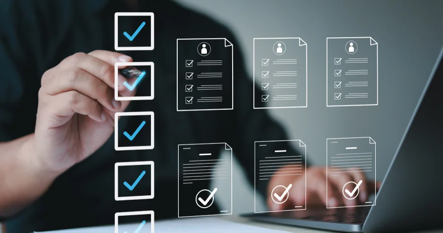 Hand checking off items on holographic document checklists, representing a digital maturity assessment.