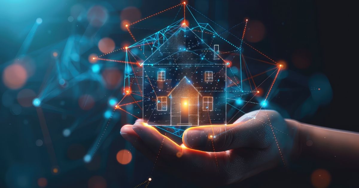 Hand holding a glowing wireframe house hologram.