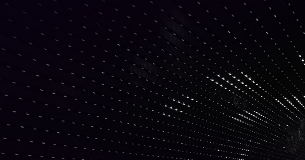 Dark dotted texture background.