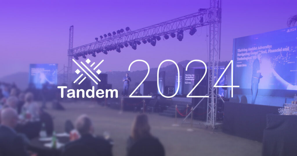 Tandem 2024 logo over an event stage.