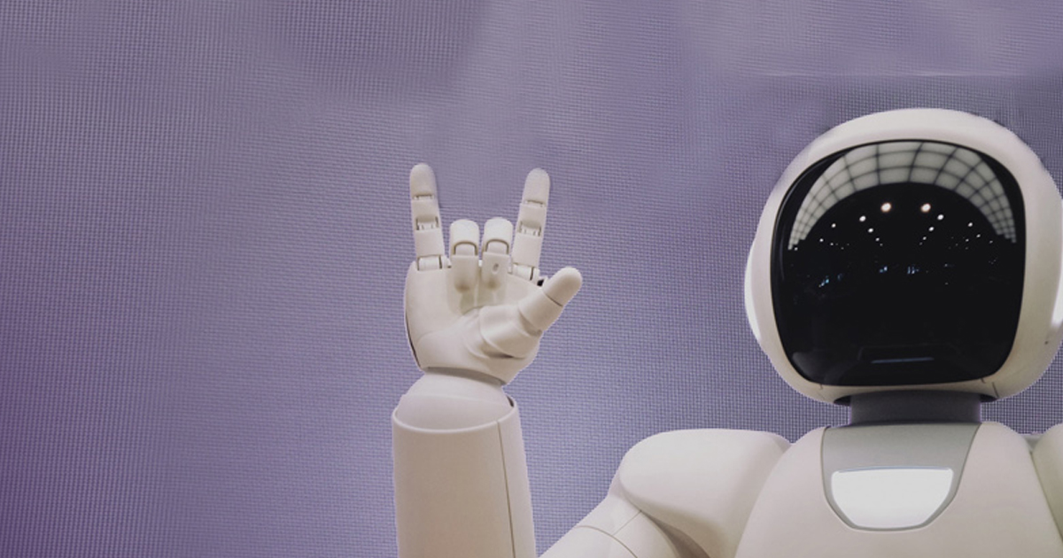 White robot raising a rock-and-roll hand gesture, representing next-generation chatbots with personality.