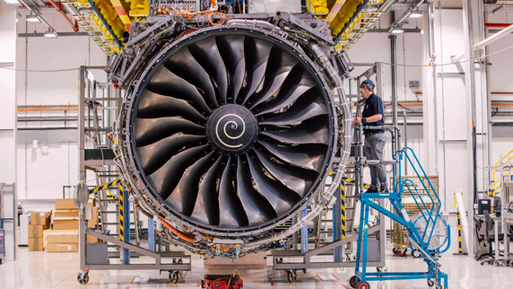 Mechanic checking an airplane turbine