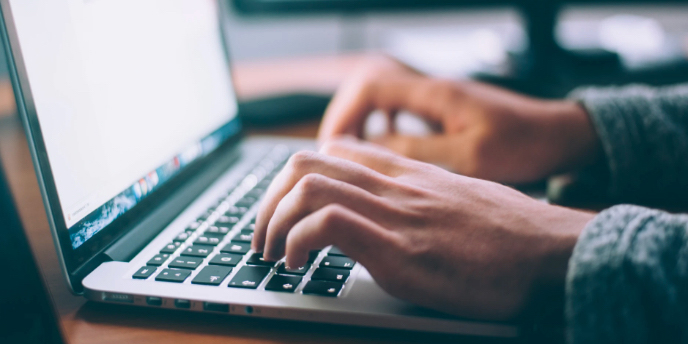 person doing online backup with a computer