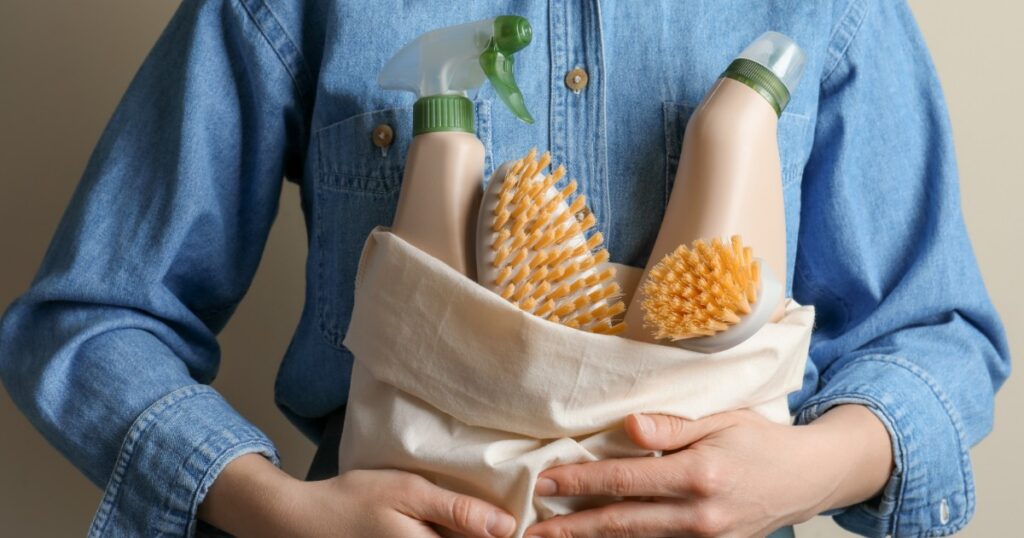 person holding a bag with eco friendly cleaning products