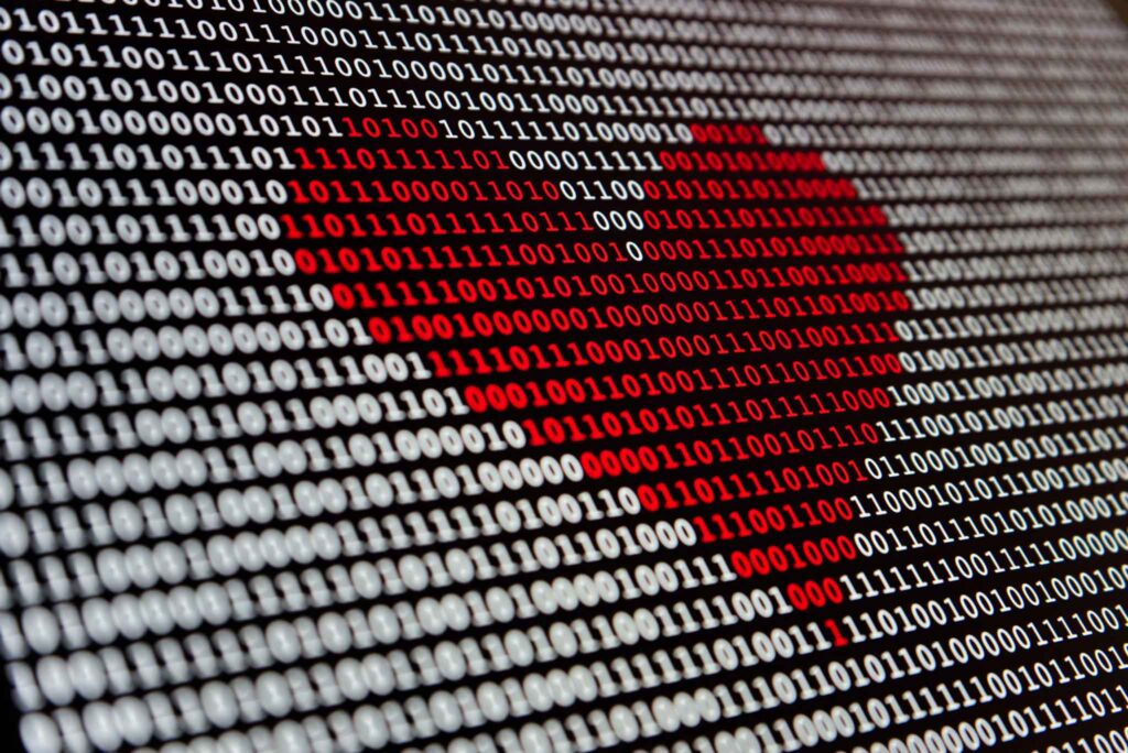 red heart made of ones and zeros.