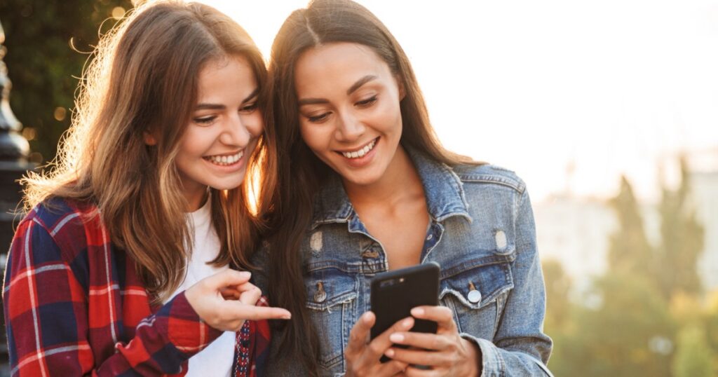 women making a secure payment using a mobile