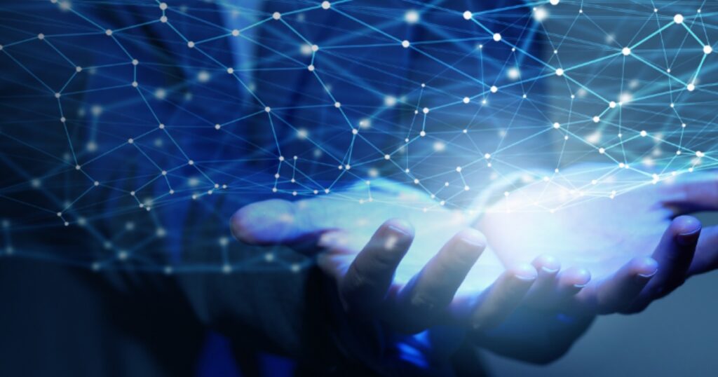 Hands cradling a glowing network sphere.