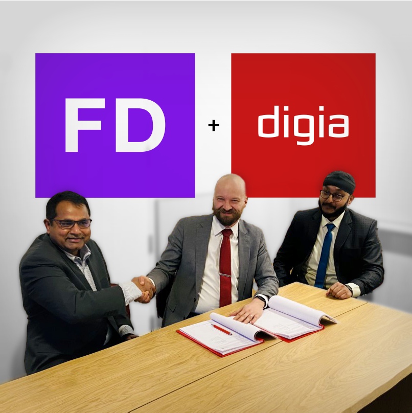 Dhana Kumarasamy and Janne Tuominen shaking hands